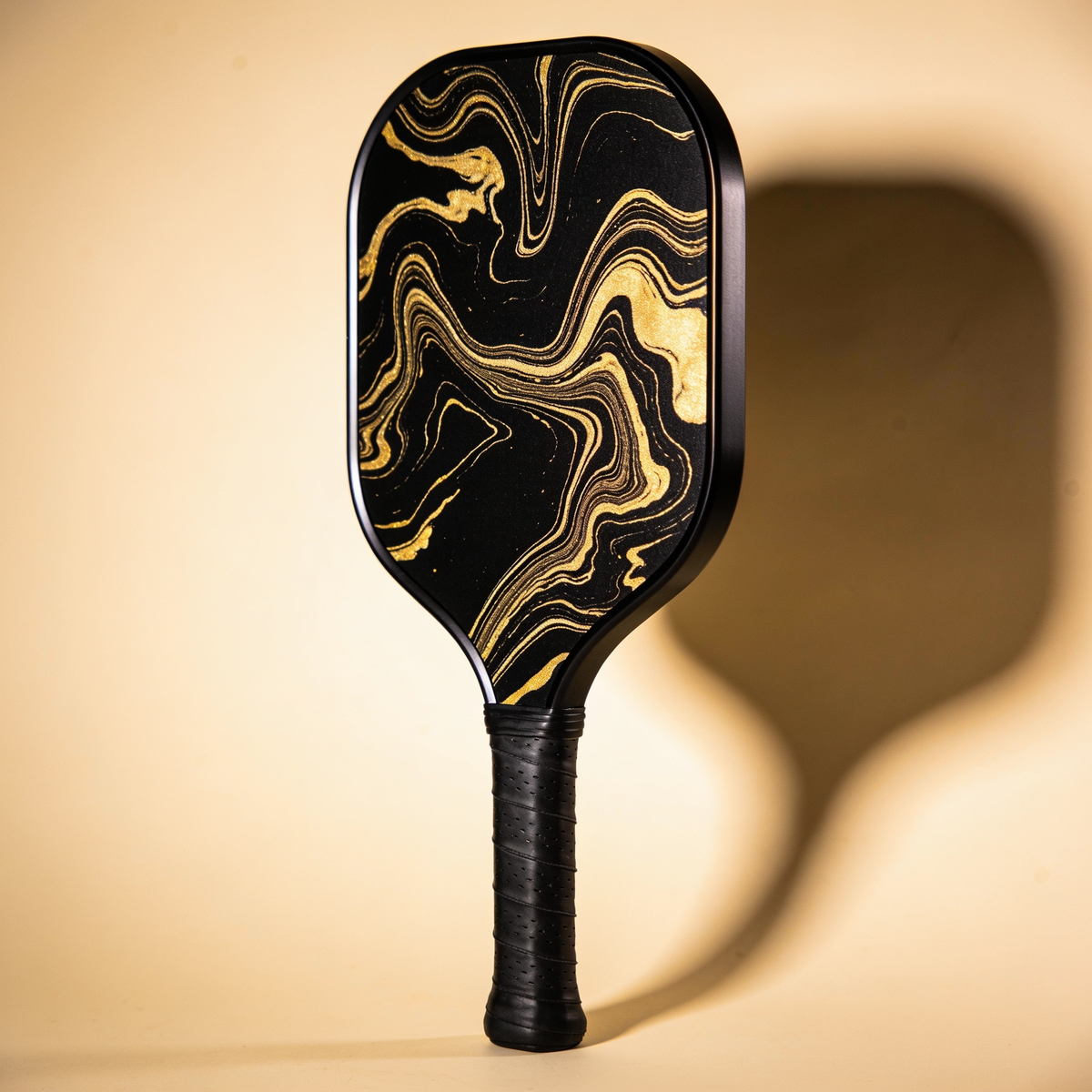 Black and gold hydro dip pickleball paddle